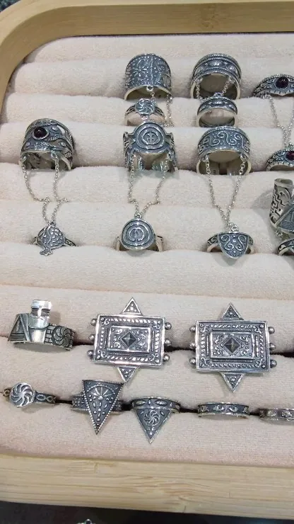 Tray of oxidised black silver rings with Armenian ornaments