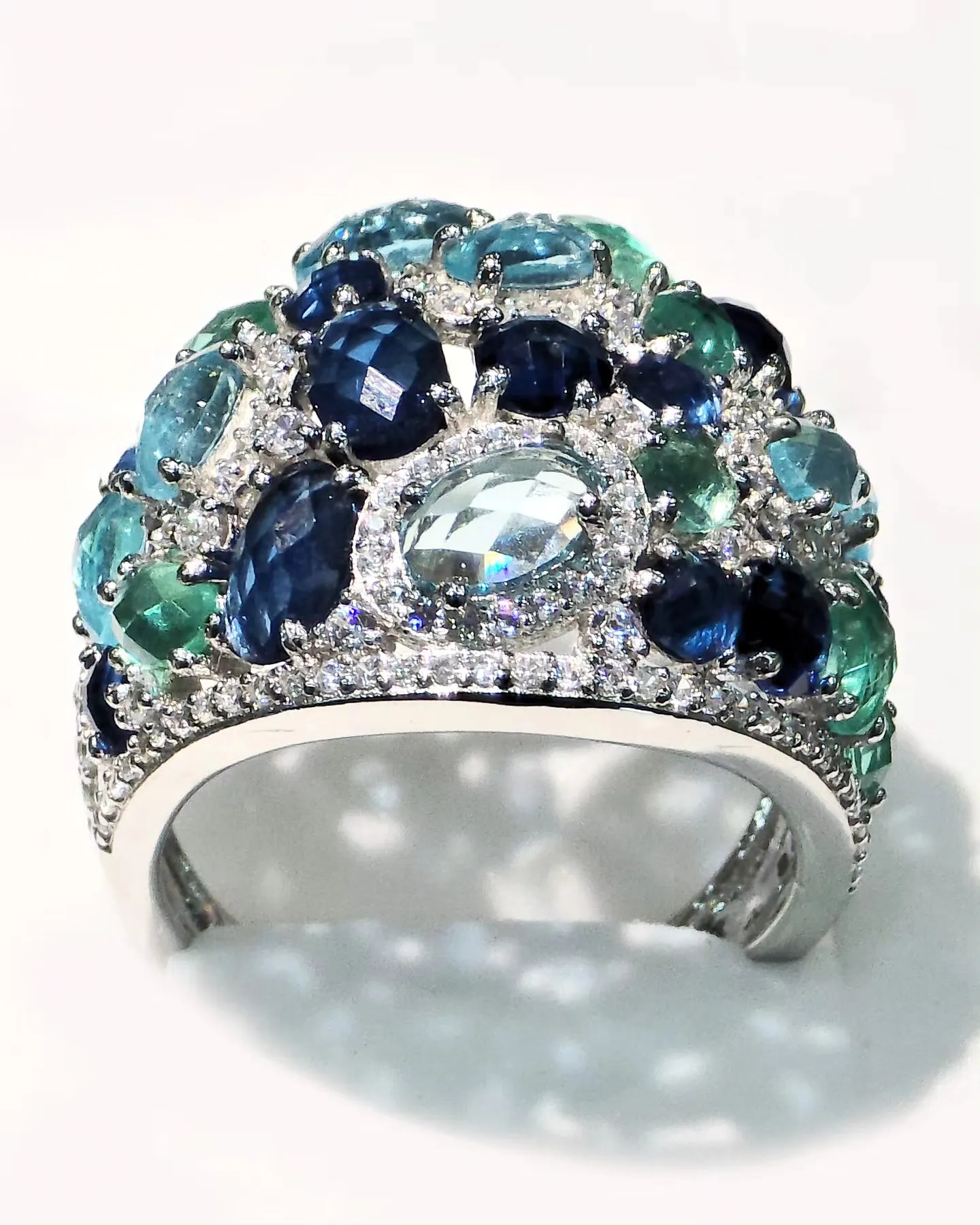 Silver cocktail ring set with blue and aqua stones
